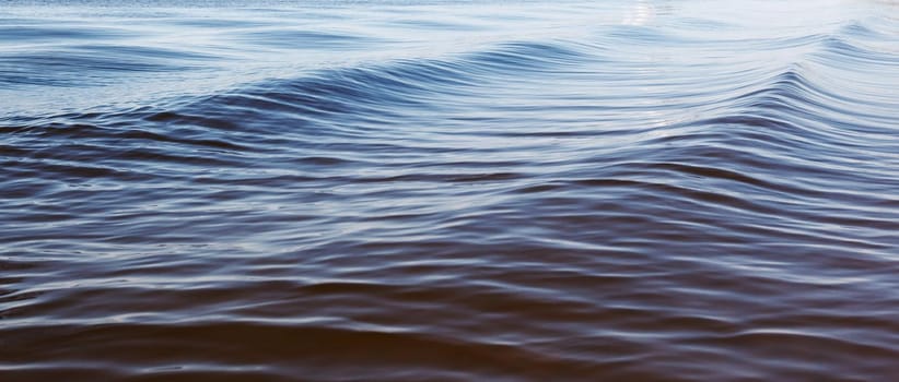 Beautiful blue small water waves in the lagoon. The photo is suitable for use as a background