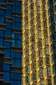 High rise building with sun bouncing of sides. High quality photo