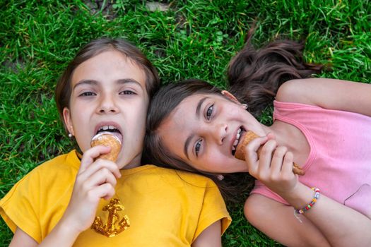 children eat ice cream in the park.selective focus.kids