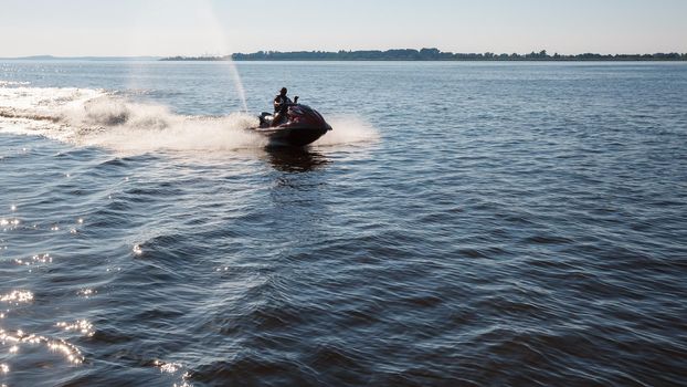 The man goes for a drive on a water motorcycle