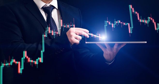 analyzes financial and investment data, planning business, finance and investment strategies on Business finance background.