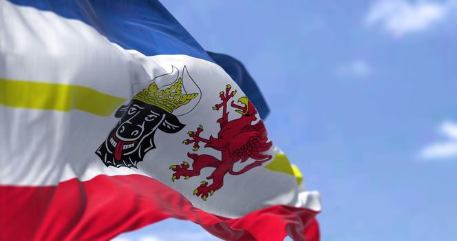 The flag of Mecklenburg–Western Pomerania waving in the wind on a clear day. Mecklenburg–Western Pomerania is a German state (Land) situated in in the north-east of Germany