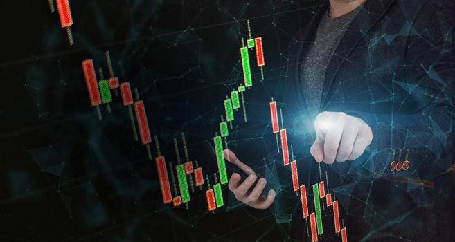 Stock market, Business growth, progress or success concept. Hand of Businessman or trader is showing a growing virtual hologram stock on smartphone