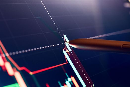 Financial chart with pen, stock analysis data for business background on digital screen. Graphs of the growth of the financial market forex. trading candlestick chart