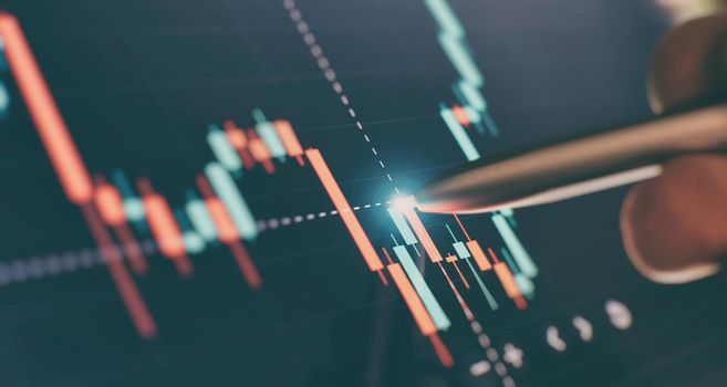 Financial chart with pen, stock analysis data for business background on digital screen. Graphs of the growth of the financial market forex. trading candlestick chart
