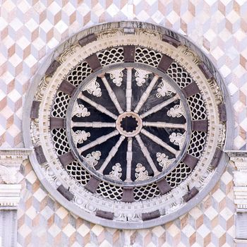 rose window of facade from Basilica of Santa Maria Maggiore, Cappella Coleoni, Piazza Duomo, Bergamo Alta Citta, Italy