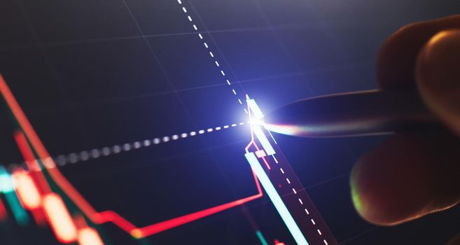 Financial chart with pen, stock analysis data for business background on digital screen. Graphs of the growth of the financial market forex. trading candlestick chart