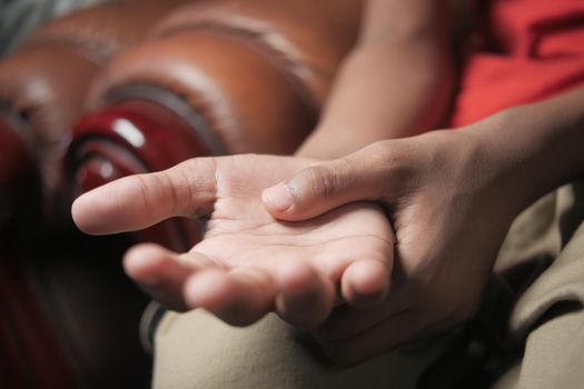 man suffering pain in hand close up .
