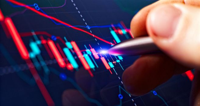 Price chart and pen indicator on screen, red and green candlestick chart on blue screen theme, market volatility, uptrend and downtrend.