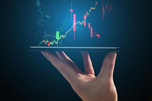 Stock market, Business growth, progress or success concept. Hand of Businessman or trader is showing a growing virtual hologram stock on smartphone