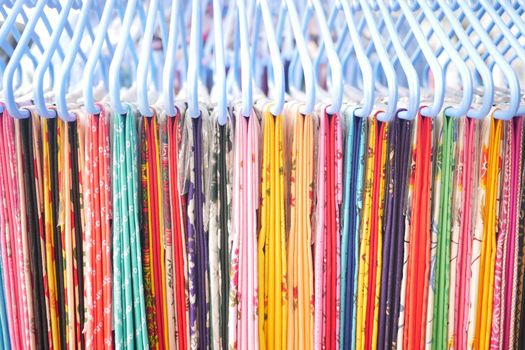 close up of many asian cloths display for sale ,