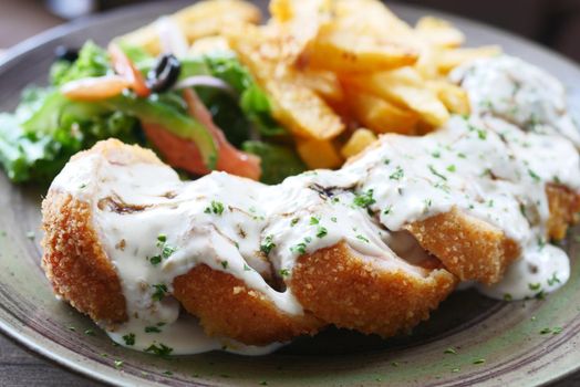 Chicken Cordon Bleu and Mayonnaise on table .