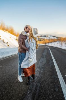 beautiful couple hugging on the road