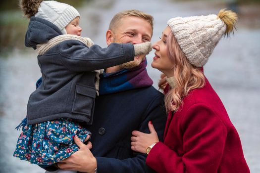 happy family in the park in winter