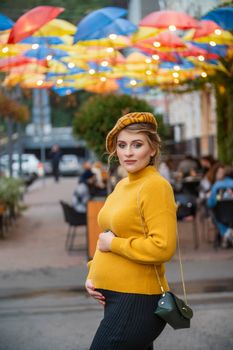 pregnant woman walking through city streets