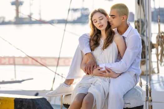 couple sitting on a yacht in the early morning