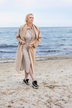 Aged woman on the background of the sea