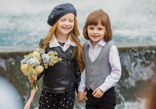 a couple of children on the background of the fountain