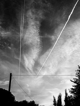 Abstract monochrome picture of sky with chemtrails