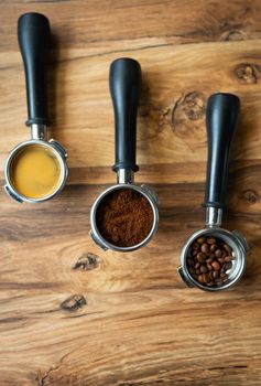 Different processes of preparing coffee by a barista in a coffee shop. Coffee beans, ground, ready. Coffee art concept