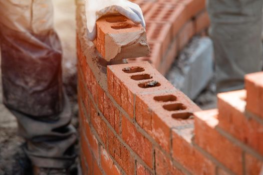 Bricklayer working on a curved wall