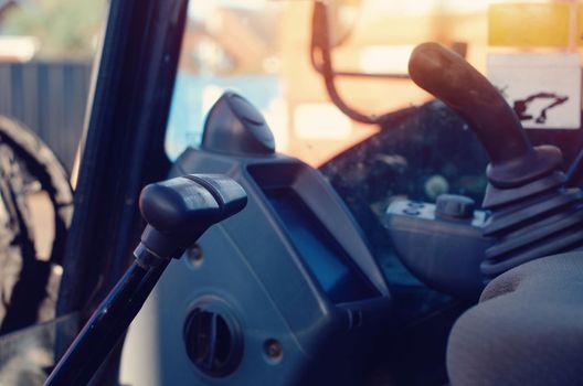 Excavator cabin and controls