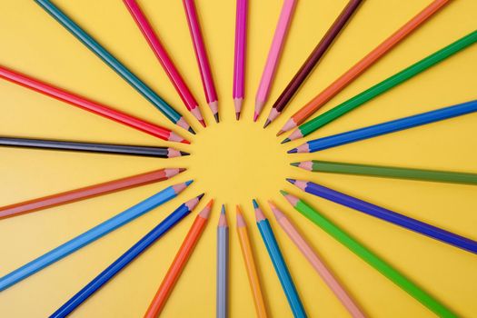 a few colored pencils on a yellow-blue background Develop creativity Get creative