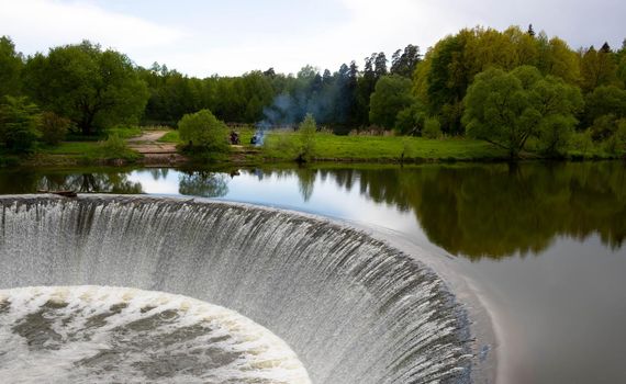 A small waterfall on a man-made river dam.