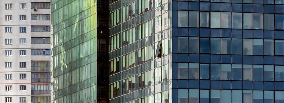 Business center, multi-storey office building on the background of residential apartments.