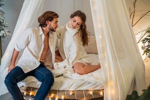 couple sitting on the couch and looking at each other