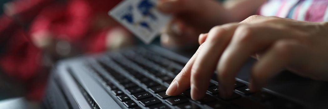 Close-up of woman pressing buttons on keyboard, pay online with credit card, remote shopping on laptop. Online shopping, purchase, technology, contactless payment concept