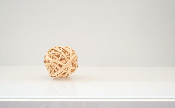 wicker ball from a vine natural colors on a light background