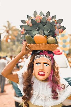 Woman disguised as La Vieja a traditional character of Nicaraguan culture during a festival en Masaya city