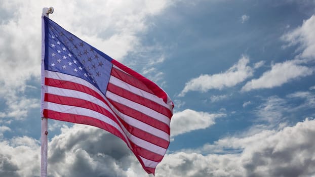 illustration of American Flag waving in sky backdrop