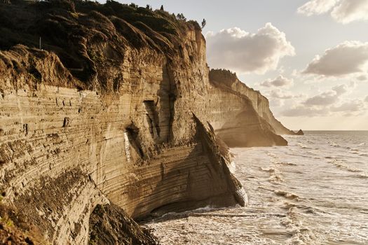 View of Logas Beach and the amazing rocky cliff in Peroulades. Corfu island. Greece.