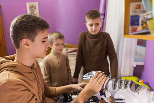 boys playing with robots in their room