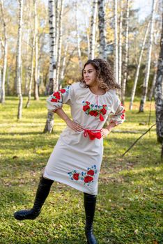 Indigenous people. beautiful woman in national ukrainian national traditional costume clothes dancing in forest