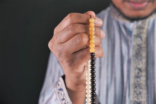 muslim man praying during ramadan .