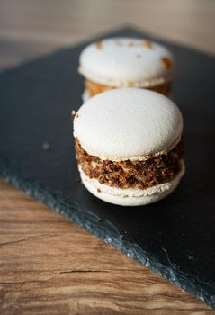 A delicious pasta dessert - a French sweet treat lies on a concrete black stand, close-up