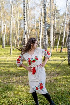 Indigenous people. beautiful woman in national ukrainian national traditional costume clothes dancing in forest