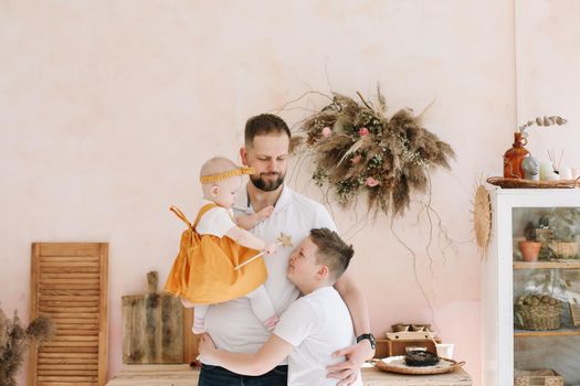 Father's day. Happy family having fun together. Father with his kids at home