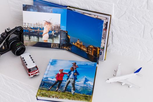 Photobook Album with Travel Photo with toy bus and plane. photo book.