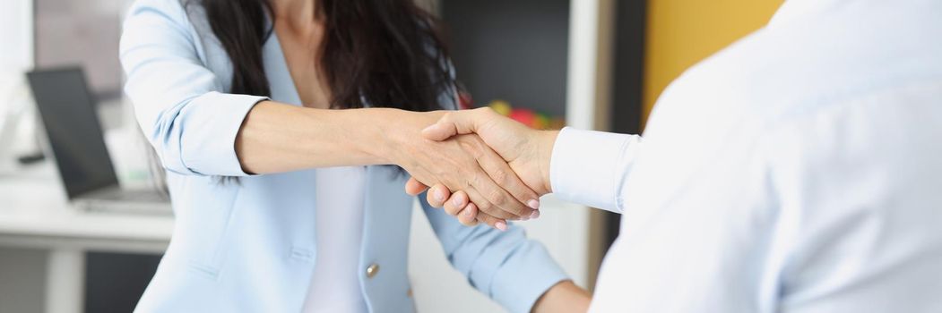 Portrait of female hr manager handshake hire male candidate at job interview, good first impression. People shaking hands after meeting, successful agreement. Business, respect concept