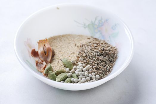 mixed of different spice on a bowl on table .