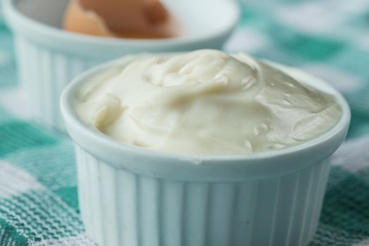close up of Mayonnaise in container on table