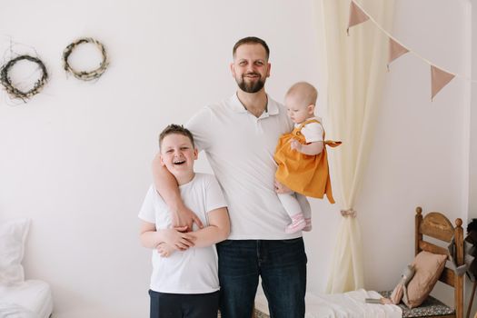 Father's day. Happy family having fun together. Father with his kids at home