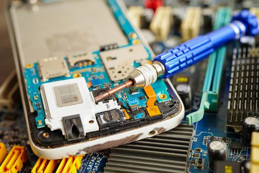 Repairing and upgrade mobile phone, electronic, computer hardware and technology concept.