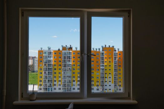 view of the apartment building from the window of room