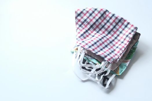 homemade face masks on white background top down .