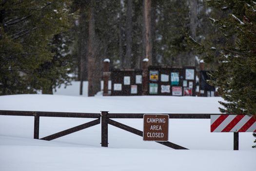 sign posted about camp is closed as it's covered with deep snow